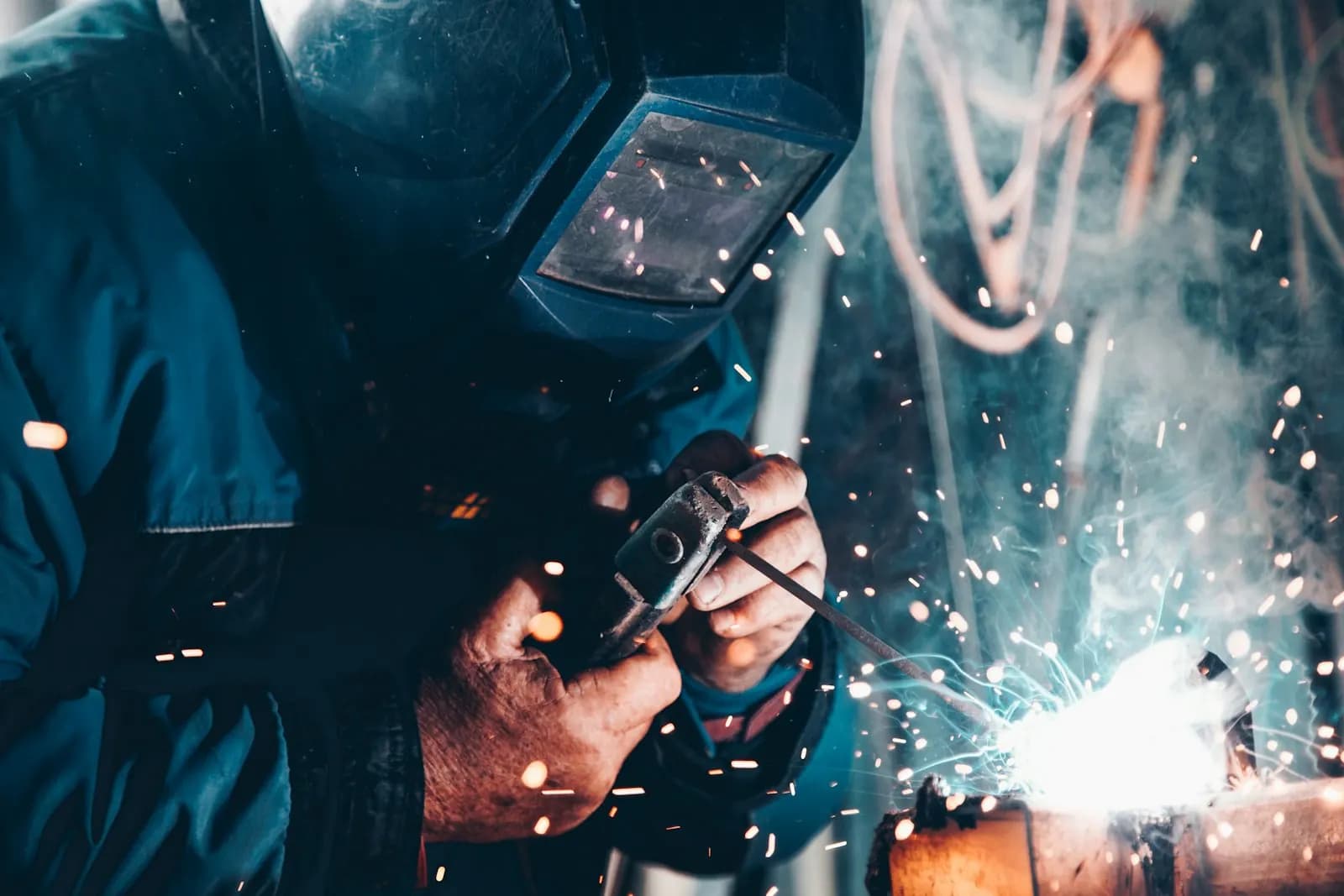 NDT technician performing ultrasonic testing on a weld joint at SMIC's Kochi campus workshop