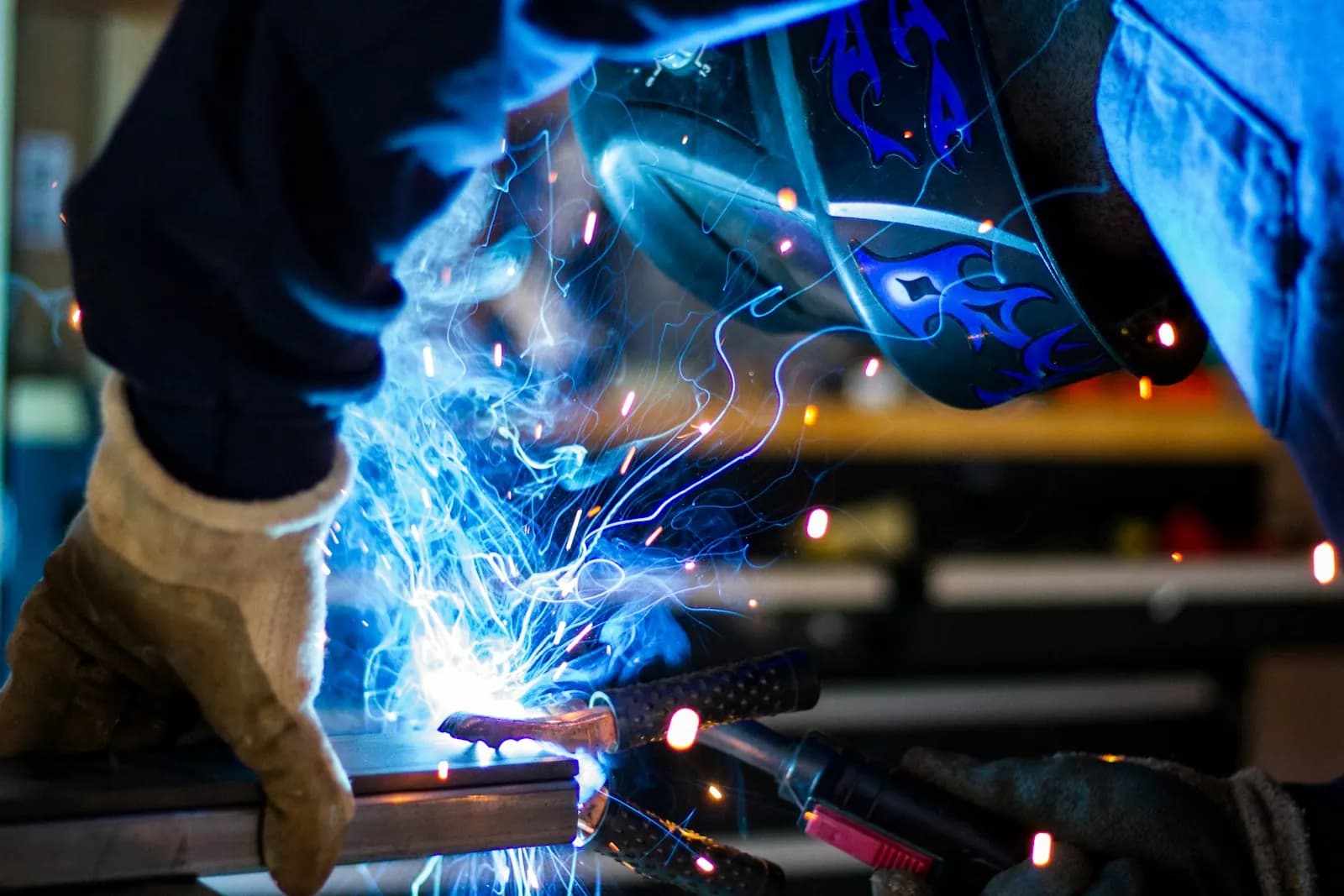 A QA/QC inspector examining a weld joint using visual inspection tools on a fabrication yard in Kochi, Kerala